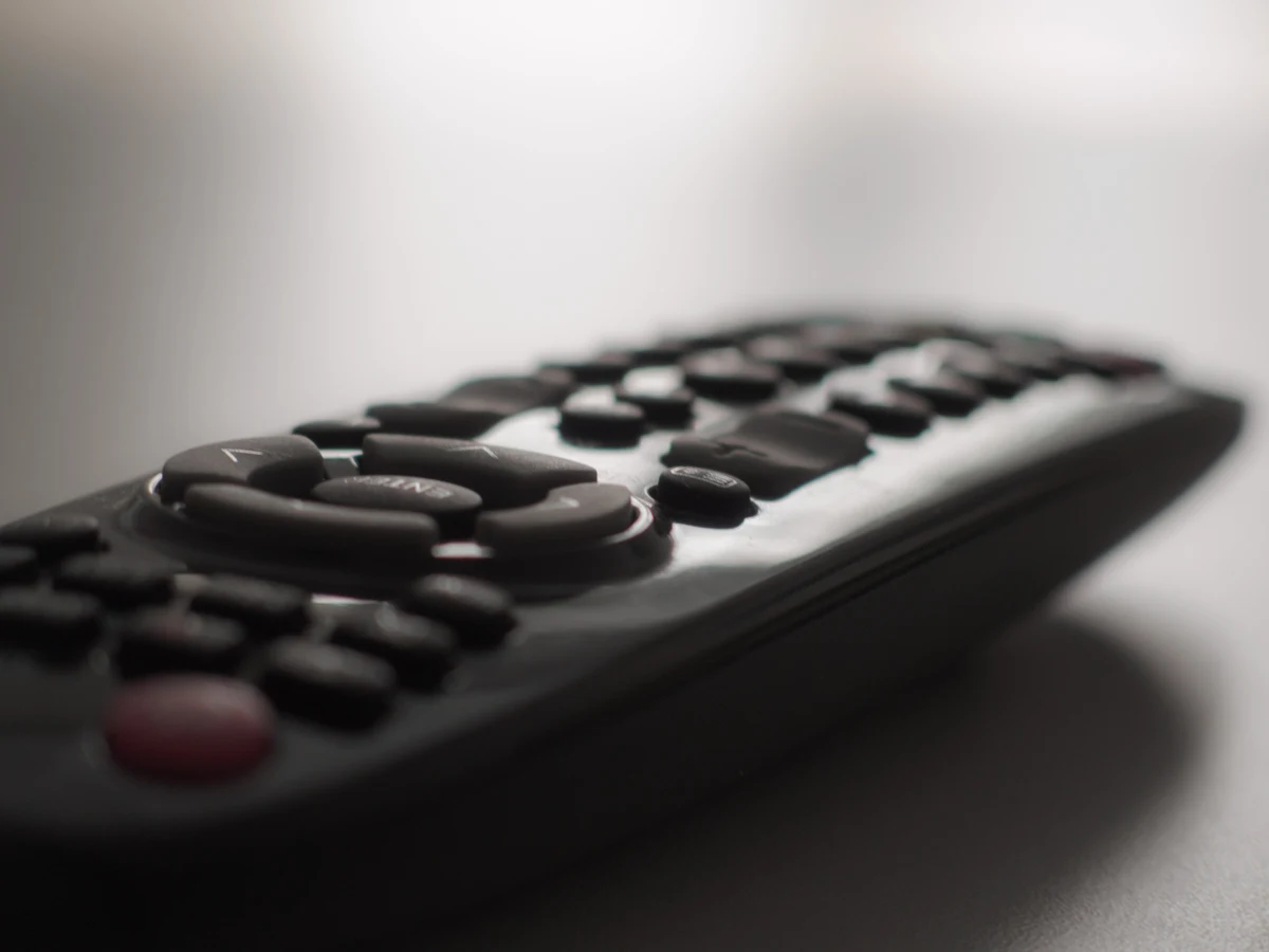 Close-up photograph of the buttons on an unbranded television remote